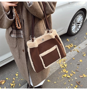 Close-up of lamb wool patchwork tote bag with brown leather strap and side pocket detail