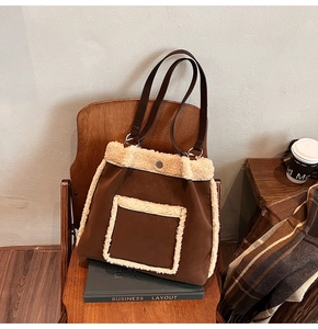 Detail of winter tote bag with faux shearling trim and large capacity pocket