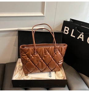 Deep brown quilted tote bag in a luxury gift box with white satin lining and paper bag