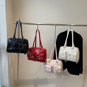 Large ballet-style shoulder bag with bows in black, red, pink and cream colors