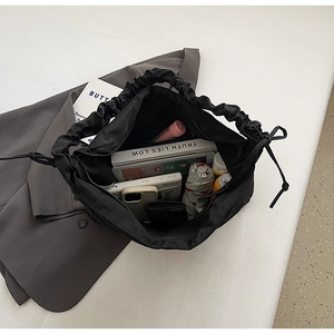Detailed view of spacious black nylon bag interior showing high storage capacity