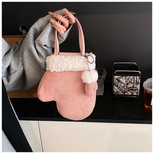 Pink glove-shaped handbag with white faux fur trim and plush pompom charm detail