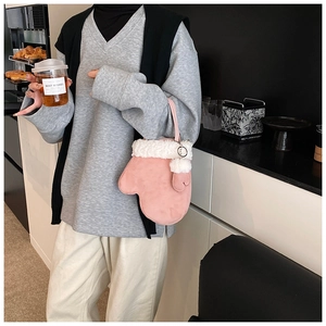 Creative pink glove-shaped handbag with plush faux fur trim and heart detail