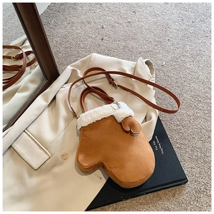 Detailed view of creative brown plush glove-shaped crossbody bag with white faux fur trim