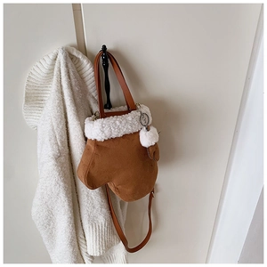 Creative glove-shaped brown suede crossbody bag with soft white faux fur trim and pompom
