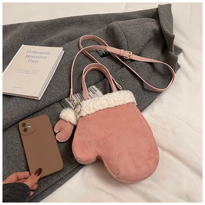 Pink glove-shaped suede crossbody bag with white faux fur trim and adjustable strap
