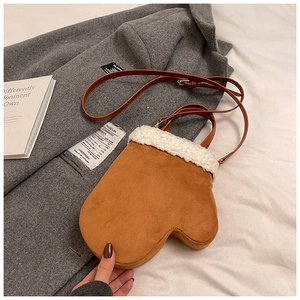 Winter crossbody bag in creative brown glove shape with white plush fur trim detail