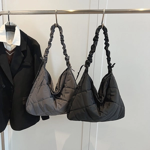 Quilted nylon large tote bag with ruffled straps for commuting in black and grey