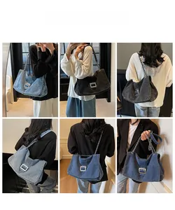 Detail view of denim tote bag with silver chain strap in blue and grey color options