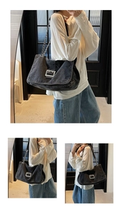 Detail view of washed denim crossbody bag with silver buckle and chain strap