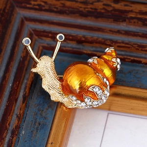Cute snail brooch with gold-plated alloy, sparkling rhinestones and orange enamel finish