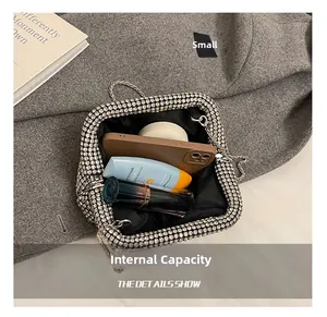 Detailed interior view of a silver rhinestone evening bag showing spacious capacity for essentials