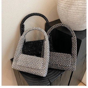 Detail showing handcrafted woven beaded handbags in silver, black, and gunmetal finishes