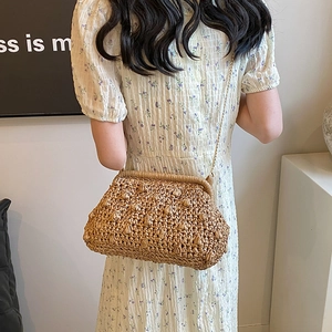 Handmade woven straw crossbody bag with gold chain strap for summer vacation
