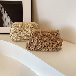 Handmade woven straw clutch bag with gold chain strap in beige and brown colors