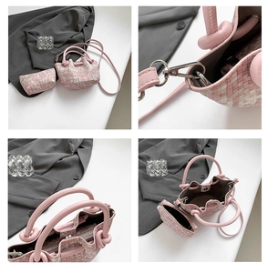 Detail of pink tweed bucket bag with drawstring closure and matching mini pouch accessory