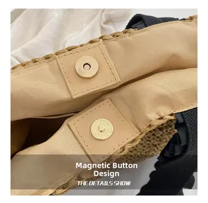 Detail shot of the magnetic snap closure and woven lining on the straw handbag