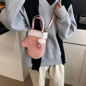Creative pink glove-shaped crossbody bucket bag with white plush faux fur trim and gold hardware