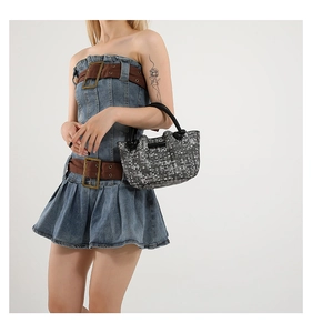 Close-up of minimalist black and white woven texture tote bag with black top handles