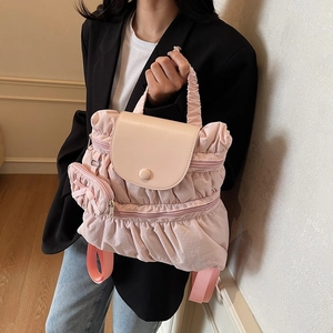 Pink ruffled nylon backpack for women featuring a double zipper and detachable small pouch