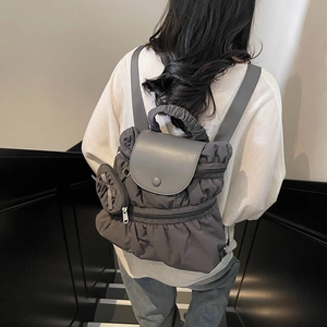 Modern charcoal grey pleated nylon backpack for women with matching small round pouch