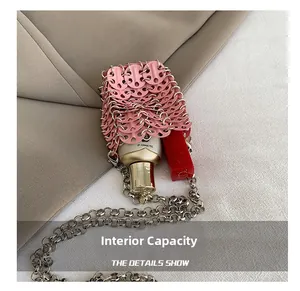 Detailed interior of a pink sequin mini bag showing space for lipstick and chain strap