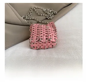 Detail view of pink sequin mini crossbody bag showing metallic ring mesh texture