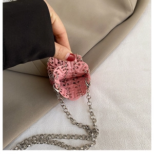 Detailed interior view of a pink sequin mini chain bag with silver link hardware