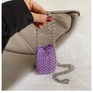 Detailed view of purple sequin mini chain bag with metallic ring link construction