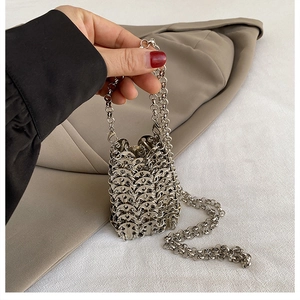 Detailed view of handmade silver metal mesh mini bag with crossbody chain strap