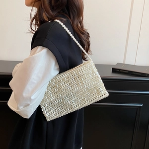Elegant handmade off-white pearl beaded handbag with woven shoulder strap for women