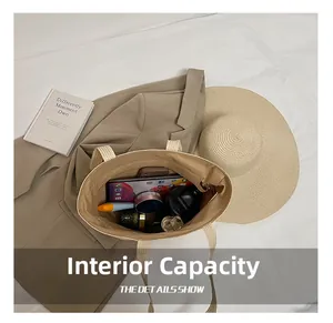 Internal capacity of straw tote bag showing tablet, cosmetics and summer essentials