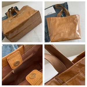 Detail view of the waterproof DuPont paper tote bag with durable stitching and magnetic buckle
