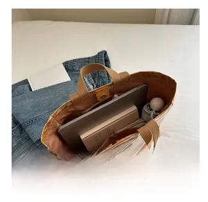 Top view of large capacity tote bag interior with laptop, umbrella and daily essentials