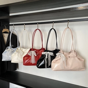 Five assorted glossy oil wax leather tote bags with lace bows and pearl chain accents