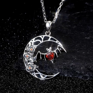 Gothic crescent moon necklace with rose relief, black bat, and red heart gemstone pendant