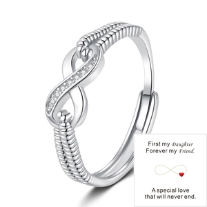 Detail of silver infinity ring with sparkling stones and mother-daughter gift card