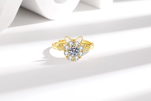 Detailed macro view of an adjustable golden rabbit ring with a sparkling round crystal center