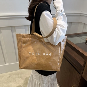 Brown Dupont paper and PVC tote bag with white TOTE BAG lettering for women