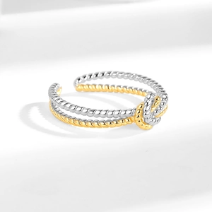 Two-tone twisted knot ring in silver and gold plating with adjustable open design