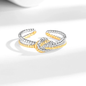 Two-tone twisted knot open ring in gold and silver finish with adjustable band for women