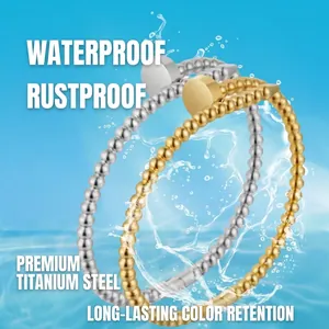 Bracciale minimalista a sfere in acciaio al titanio impermeabile oro e argento con spruzzi d'acqua