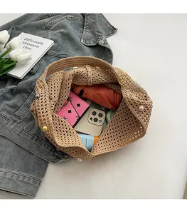 Internal view of handmade woven tote bag showing large capacity for phone and umbrella