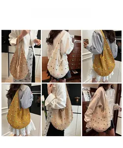 Detail of hollow knit shoulder bag with colored beads in beige, cream, and yellow colors
