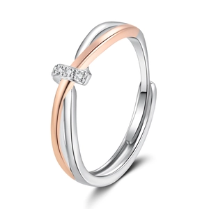 Anello aperto bicolore argento e oro rosa intrecciato con quattro piccoli diamanti