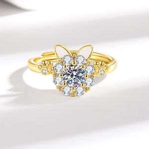 Rotating lucky cat ring with white rabbit ears and sparkling crystals on golden band