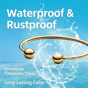 18K gold plated titanium steel knot cuff bracelet with ball ends and waterproof finish