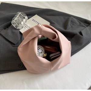 Pink leather tote bag interior showing large capacity for umbrella, phone, and wallet