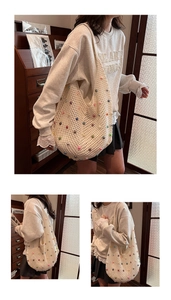 Close-up of cream crochet shoulder bag featuring colorful beads and hollow knit texture