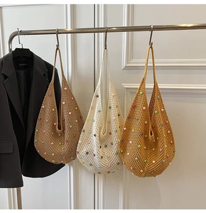 Detail of hand-knitted mesh tote bags featuring colorful pearls in khaki and beige